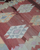 Vintage kilim rug in room decor setting, old rug, antique rug, pastel colors, faded colors, Turkish rug, vintage rug, soft rug, Portland, Oregon, rug store, rug shop, local shop, bold colors, bright colors, faded colors