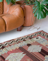 Vintage kilim rug in room decor setting, old rug, antique rug, pastel colors, faded colors, Turkish rug, vintage rug, soft rug, Portland, Oregon, rug store, rug shop, local shop, bold colors, bright colors, faded colors