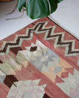 Vintage kilim rug in room decor setting, old rug, antique rug, pastel colors, faded colors, Turkish rug, vintage rug, soft rug, Portland, Oregon, rug store, rug shop, local shop, bold colors, bright colors, faded colors