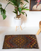 Vintage mini kilim rug in room decor setting, kilim, Turkish rug, vintage rug, portland, rug shop, bright colors, wild shaman, soft rug, bold color, Portland, Oregon, rug store, rug shop, local shop