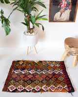 Vintage mini kilim rug in room decor setting, kilim, Turkish rug, vintage rug, portland, rug shop, bright colors, wild shaman, soft rug, bold color, Portland, Oregon, rug store, rug shop, local shop