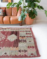 Vintage kilim rug in room decor setting, old rug, antique rug, pastel colors, faded colors, Turkish rug, vintage rug, soft rug, Portland, Oregon, rug store, rug shop, local shop, bold colors, bright colors, faded colors