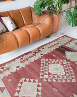 Vintage kilim rug in room decor setting, old rug, antique rug, pastel colors, faded colors, Turkish rug, vintage rug, soft rug, Portland, Oregon, rug store, rug shop, local shop, bold colors, bright colors, faded colors