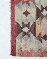 Vintage kilim rug in room decor setting, old rug, antique rug, pastel colors, faded colors, Turkish rug, vintage rug, soft rug, Portland, Oregon, rug store, rug shop, local shop, bold colors, bright colors, faded colors