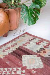 Vintage kilim rug in room decor setting, old rug, antique rug, pastel colors, faded colors, Turkish rug, vintage rug, soft rug, Portland, Oregon, rug store, rug shop, local shop, bold colors, bright colors, faded colors
