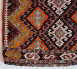 Vintage mini kilim rug in room decor setting, kilim, Turkish rug, vintage rug, portland, rug shop, bright colors, wild shaman, soft rug, bold color, Portland, Oregon, rug store, rug shop, local shop