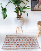 Vintage mini kilim rug in room decor setting, kilim, Turkish rug, vintage rug, portland, rug shop, bright colors, wild shaman, soft rug, bold color, Portland, Oregon, rug store, rug shop, local shop