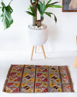 Vintage mini kilim rug in room decor setting, kilim, Turkish rug, vintage rug, portland, rug shop, bright colors, wild shaman, soft rug, bold color, Portland, Oregon, rug store, rug shop, local shop