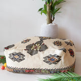 Floor pouf in a living room setting, pillow, turkish pillow, kilim pillow, home decor, decorative pillow, sham, rug pillow, decor, home decor, pouf, floor cushion, cushion, Portland, rugshop, Oregon, Wild Shaman, ottoman