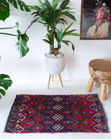 Vintage mini kilim rug in room decor setting, kilim, Turkish rug, vintage rug, portland, rug shop, bright colors, wild shaman, soft rug, bold color, Portland, Oregon, rug store, rug shop, local shop