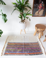 Vintage mini kilim rug in room decor setting, kilim, Turkish rug, vintage rug, portland, rug shop, bright colors, wild shaman, soft rug, bold color, Portland, Oregon, rug store, rug shop, local shop