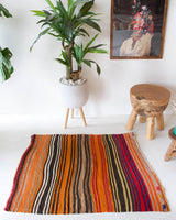 Vintage mini kilim rug in room decor setting, kilim, Turkish rug, vintage rug, portland, rug shop, bright colors, wild shaman, soft rug, bold color, Portland, Oregon, rug store, rug shop, local shop