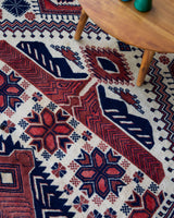 Vintage Turkish rug in a living room setting, pile rug, Turkish rug, vintage rug, portland, rug shop, bright colors, wild shaman, soft rug, bold color, Portland, Oregon, rug store, rug shop, local shop, antique rug