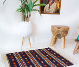 Vintage mini kilim rug in room decor setting, kilim, Turkish rug, vintage rug, portland, rug shop, bright colors, wild shaman, soft rug, bold color, Portland, Oregon, rug store, rug shop, local shop