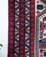 Vintage Turkish rug in a living room setting, pile rug, Turkish rug, vintage rug, portland, rug shop, bright colors, wild shaman, soft rug, bold color, Portland, Oregon, rug store, rug shop, local shop, antique rug