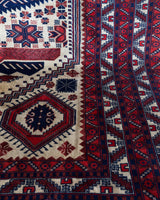 Vintage Turkish rug in a living room setting, pile rug, Turkish rug, vintage rug, portland, rug shop, bright colors, wild shaman, soft rug, bold color, Portland, Oregon, rug store, rug shop, local shop, antique rug