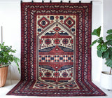 Vintage Turkish rug in a living room setting, pile rug, Turkish rug, vintage rug, portland, rug shop, bright colors, wild shaman, soft rug, bold color, Portland, Oregon, rug store, rug shop, local shop, antique rug