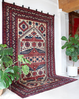 Vintage Turkish rug in a living room setting, pile rug, Turkish rug, vintage rug, portland, rug shop, bright colors, wild shaman, soft rug, bold color, Portland, Oregon, rug store, rug shop, local shop, antique rug