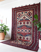 Vintage Turkish rug in a living room setting, pile rug, Turkish rug, vintage rug, portland, rug shop, bright colors, wild shaman, soft rug, bold color, Portland, Oregon, rug store, rug shop, local shop, antique rug