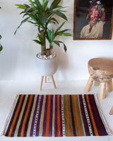 Vintage mini kilim rug in room decor setting, kilim, Turkish rug, vintage rug, portland, rug shop, bright colors, wild shaman, soft rug, bold color, Portland, Oregon, rug store, rug shop, local shop