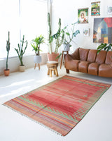 Vintage kilim rug in room decor setting, old rug, antique rug, pastel colors, faded colors, Turkish rug, vintage rug, soft rug, Portland, Oregon, rug store, rug shop, local shop, bold colors, bright colors, faded colors