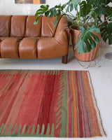 Vintage kilim rug in room decor setting, old rug, antique rug, pastel colors, faded colors, Turkish rug, vintage rug, soft rug, Portland, Oregon, rug store, rug shop, local shop, bold colors, bright colors, faded colors