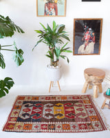 Vintage mini kilim rug in room decor setting, kilim, Turkish rug, vintage rug, portland, rug shop, bright colors, wild shaman, soft rug, bold color, Portland, Oregon, rug store, rug shop, local shop