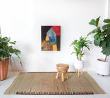 Vintage kilim rug in living room setting, old rug, antique rug, pastel colors, faded colors, Turkish rug, vintage rug, soft rug, Portland, Oregon, rug store, rug shop, local shop, earthy tones, earthy colors, warm colors