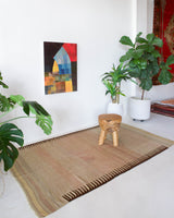 Vintage kilim rug in living room setting, old rug, antique rug, pastel colors, faded colors, Turkish rug, vintage rug, soft rug, Portland, Oregon, rug store, rug shop, local shop, earthy tones, earthy colors, warm colors