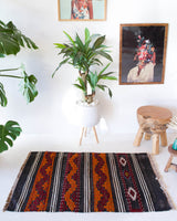 Vintage mini kilim rug in room decor setting, kilim, Turkish rug, vintage rug, portland, rug shop, bright colors, wild shaman, soft rug, bold color, Portland, Oregon, rug store, rug shop, local shop