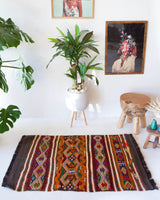 Vintage mini kilim rug in room decor setting, kilim, Turkish rug, vintage rug, portland, rug shop, bright colors, wild shaman, soft rug, bold color, Portland, Oregon, rug store, rug shop, local shop