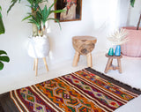 Vintage mini kilim rug in room decor setting, kilim, Turkish rug, vintage rug, portland, rug shop, bright colors, wild shaman, soft rug, bold color, Portland, Oregon, rug store, rug shop, local shop
