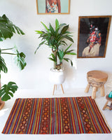 Vintage mini kilim rug in room decor setting, kilim, Turkish rug, vintage rug, portland, rug shop, bright colors, wild shaman, soft rug, bold color, Portland, Oregon, rug store, rug shop, local shop