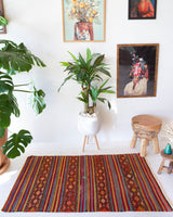 Vintage mini kilim rug in room decor setting, kilim, Turkish rug, vintage rug, portland, rug shop, bright colors, wild shaman, soft rug, bold color, Portland, Oregon, rug store, rug shop, local shop