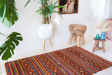 Vintage mini kilim rug in room decor setting, kilim, Turkish rug, vintage rug, portland, rug shop, bright colors, wild shaman, soft rug, bold color, Portland, Oregon, rug store, rug shop, local shop