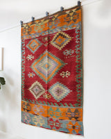Vintage kilim rug in living room setting, bright colors, wild shaman, soft rug, bold color, Portland, Oregon, rug store, rug shop, local shop, vintage rug, modern kilim, warm colors