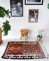Vintage mini kilim rug in room decor setting, kilim, Turkish rug, vintage rug, portland, rug shop, bright colors, wild shaman, soft rug, bold color, Portland, Oregon, rug store, rug shop, local shop