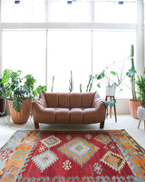 Vintage kilim rug in living room setting, bright colors, wild shaman, soft rug, bold color, Portland, Oregon, rug store, rug shop, local shop, vintage rug, modern kilim, warm colors