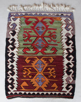 Vintage mini kilim rug in room decor setting, kilim, Turkish rug, vintage rug, portland, rug shop, bright colors, wild shaman, soft rug, bold color, Portland, Oregon, rug store, rug shop, local shop