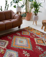 Vintage kilim rug in living room setting, bright colors, wild shaman, soft rug, bold color, Portland, Oregon, rug store, rug shop, local shop, vintage rug, modern kilim, warm colors
