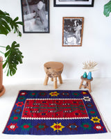 Vintage mini kilim rug in room decor setting, kilim, Turkish rug, vintage rug, portland, rug shop, bright colors, wild shaman, soft rug, bold color, Portland, Oregon, rug store, rug shop, local shop