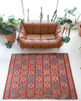 Vintage kilim rug in room decor setting, old rug, antique rug, pastel colors, faded colors, Turkish rug, vintage rug, soft rug, Portland, Oregon, rug store, rug shop, local shop, bold colors, bright colors, faded colors