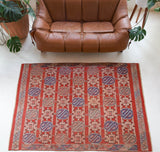 Vintage kilim rug in room decor setting, old rug, antique rug, pastel colors, faded colors, Turkish rug, vintage rug, soft rug, Portland, Oregon, rug store, rug shop, local shop, bold colors, bright colors, faded colors