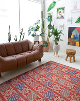 Vintage kilim rug in room decor setting, old rug, antique rug, pastel colors, faded colors, Turkish rug, vintage rug, soft rug, Portland, Oregon, rug store, rug shop, local shop, bold colors, bright colors, faded colors