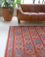 Vintage kilim rug in room decor setting, old rug, antique rug, pastel colors, faded colors, Turkish rug, vintage rug, soft rug, Portland, Oregon, rug store, rug shop, local shop, bold colors, bright colors, faded colors