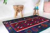 Vintage mini kilim rug in room decor setting, kilim, Turkish rug, vintage rug, portland, rug shop, bright colors, wild shaman, soft rug, bold color, Portland, Oregon, rug store, rug shop, local shop