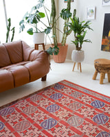 Vintage kilim rug in room decor setting, old rug, antique rug, pastel colors, faded colors, Turkish rug, vintage rug, soft rug, Portland, Oregon, rug store, rug shop, local shop, bold colors, bright colors, faded colors