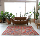 Vintage kilim rug in room decor setting, old rug, antique rug, pastel colors, faded colors, Turkish rug, vintage rug, soft rug, Portland, Oregon, rug store, rug shop, local shop, bold colors, bright colors, faded colors