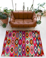Vintage kilim rug in living room setting, bright colors, wild shaman, soft rug, bold color, Portland, Oregon, rug store, rug shop, local shop, vintage rug, modern kilim, warm colors