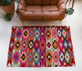 Vintage kilim rug in living room setting, bright colors, wild shaman, soft rug, bold color, Portland, Oregon, rug store, rug shop, local shop, vintage rug, modern kilim, warm colors